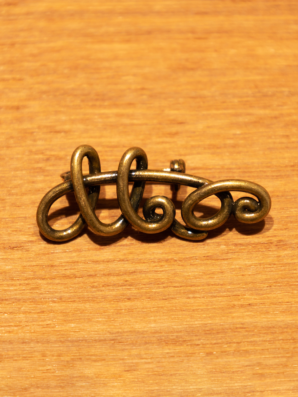 Twisted Logo Badge-Gold Brass